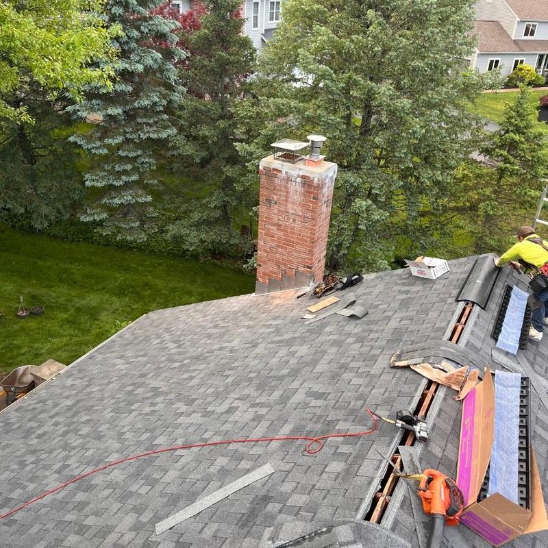 Asphalt shingle roof installation with chimney in Cromwell CT Asphalt shingle roof installation with chimney in Cromwell CT