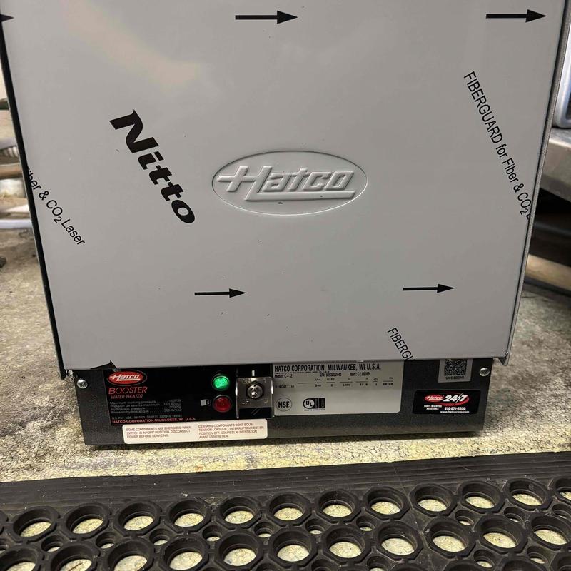 Hatto booster water heater unit on floor mat