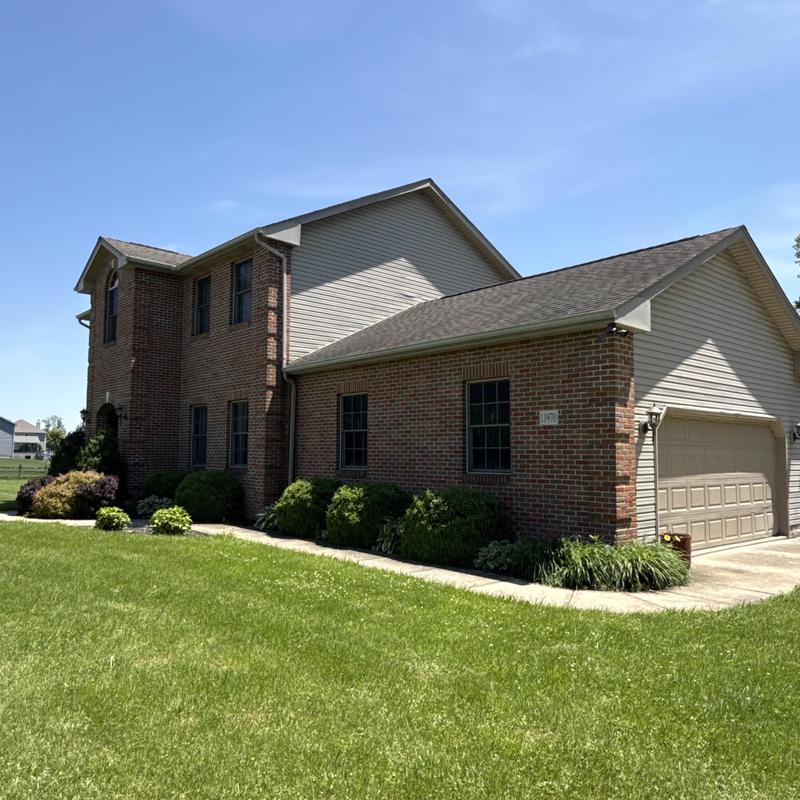 Fascia board on brick and siding house exterior Fascia board on brick and siding house exterior