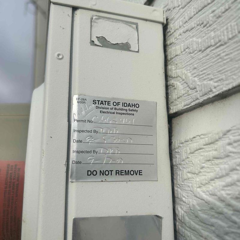 Electrical inspection permit label on service panel box