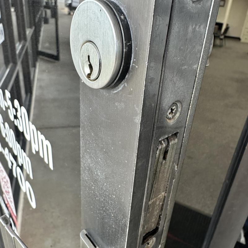 Commercial glass door lock cylinder close-up