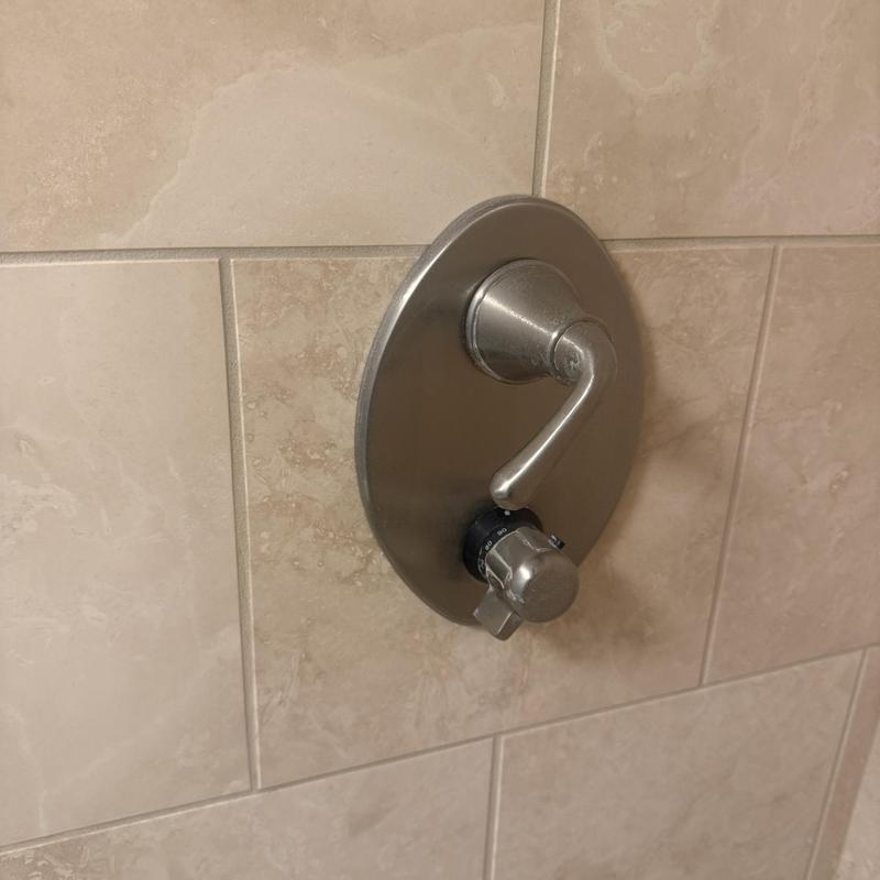 Thermo shower cartridge with control handle on tile wall