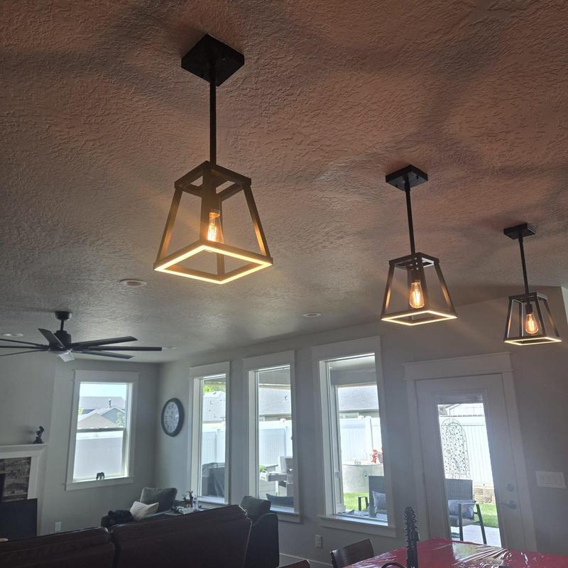 Pendant light fixtures installed on ceiling cans
