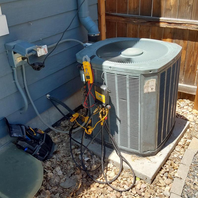 Trane XR14 air conditioner with diagnostic gauges attached
