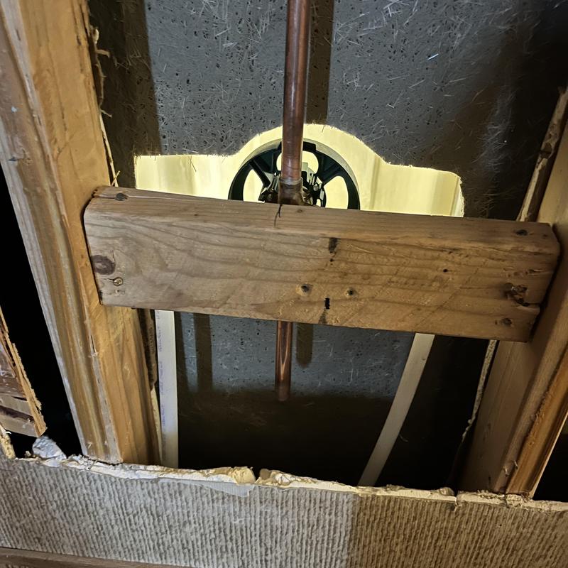 Copper shower valve installation behind wall with support beam