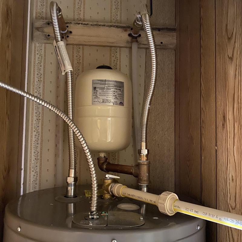 Water heater with expansion tank and supply lines