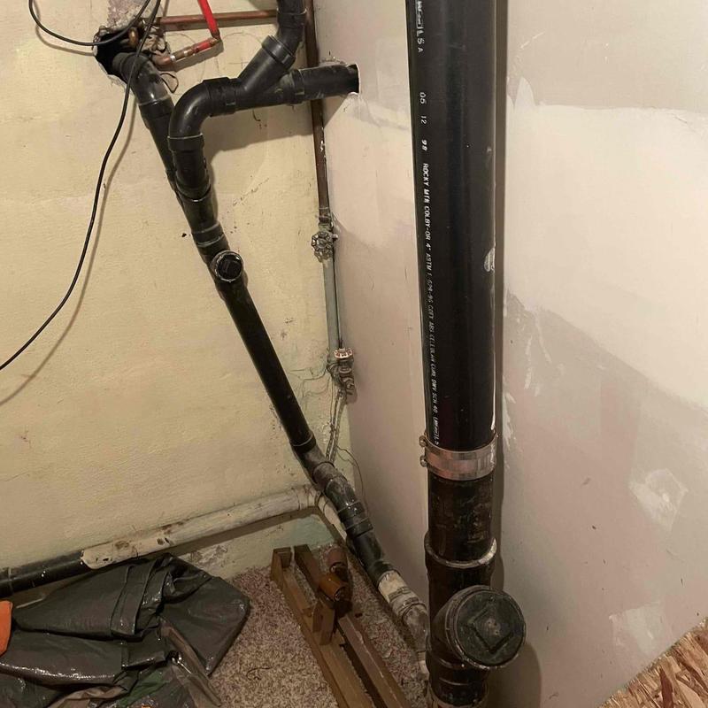 Kitchen sink drain pipes with clog debris removed