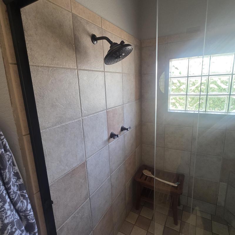 Shower valve and trim installed behind tiled wall