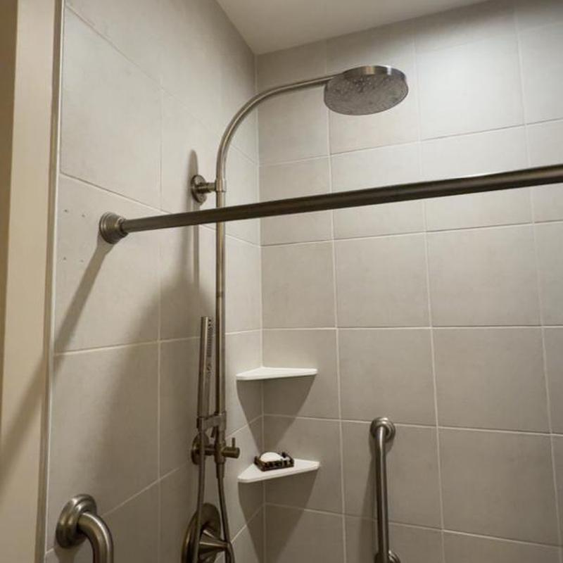 Hydro rail shower system with grab bars and shelves