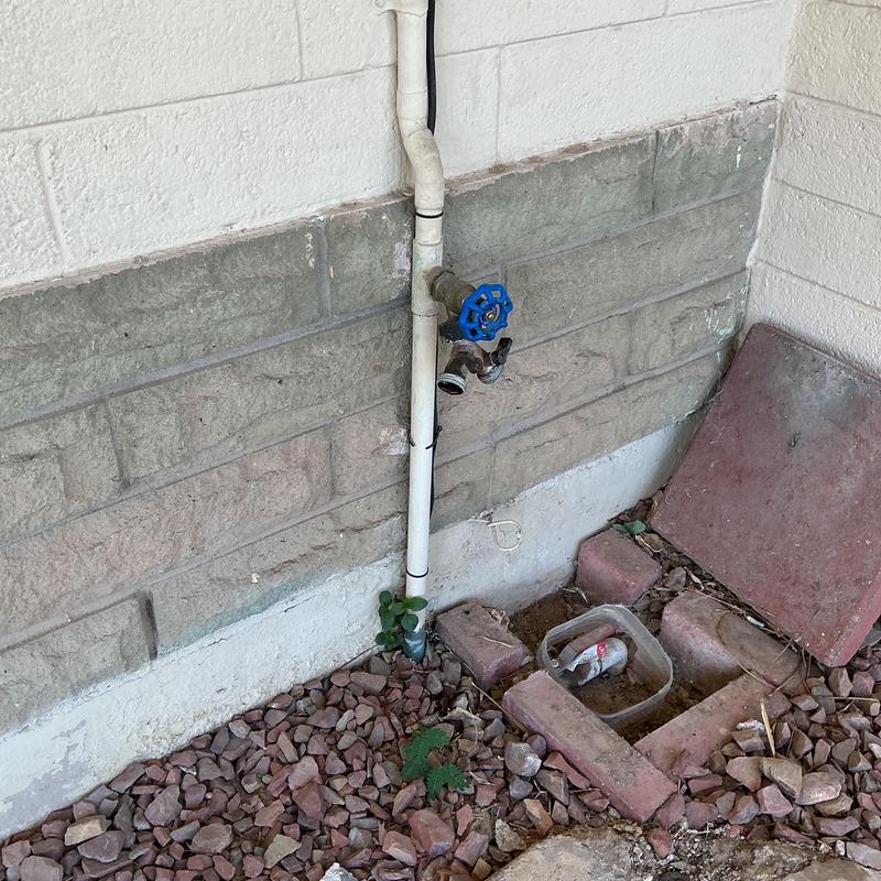 Outdoor water supply pipe with blue valve handle