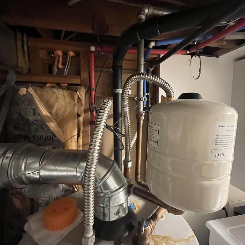 Gas water heater with expansion tank and vent pipes