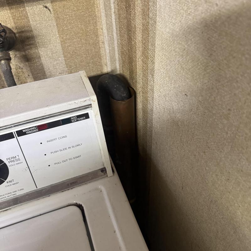 Laundry drain pipe clogged with lint buildup cleared
