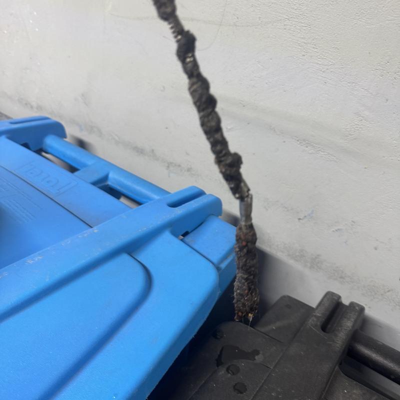 Drain line lint blockage removed from laundry drain snake tool