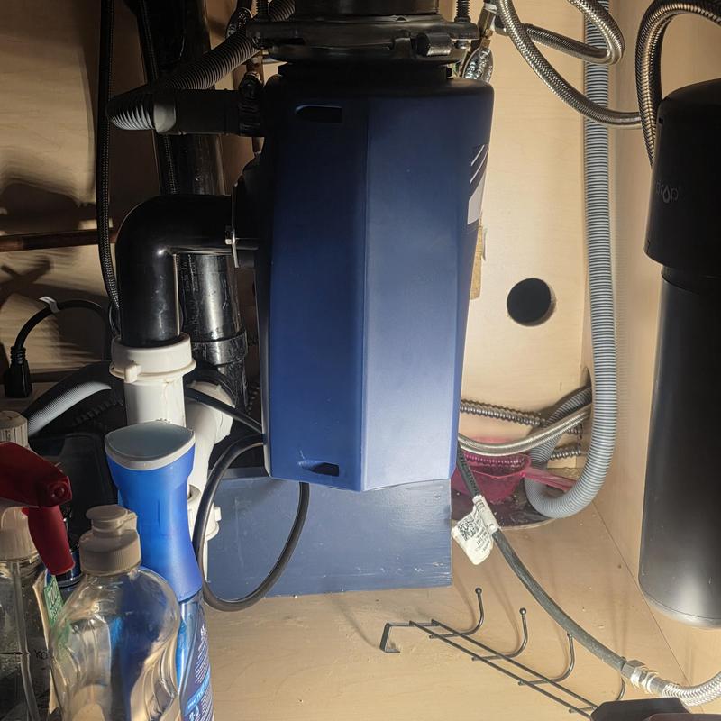 Garbage disposal unit installed under kitchen sink Garbage disposal unit installed under kitchen sink