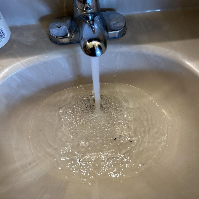 Sink drain clearing restoring water flow