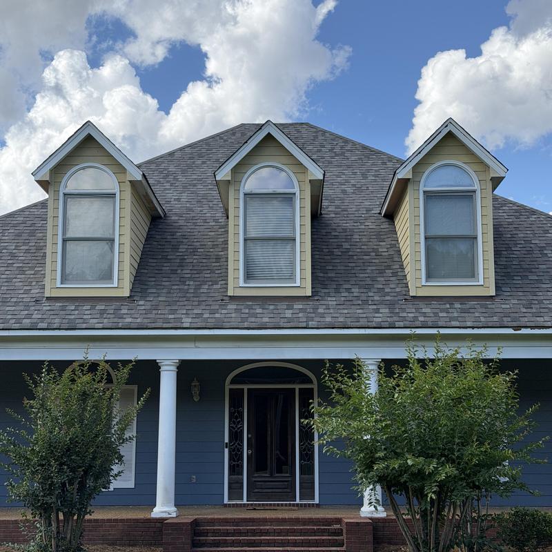 Dormer siding installation on residential roof