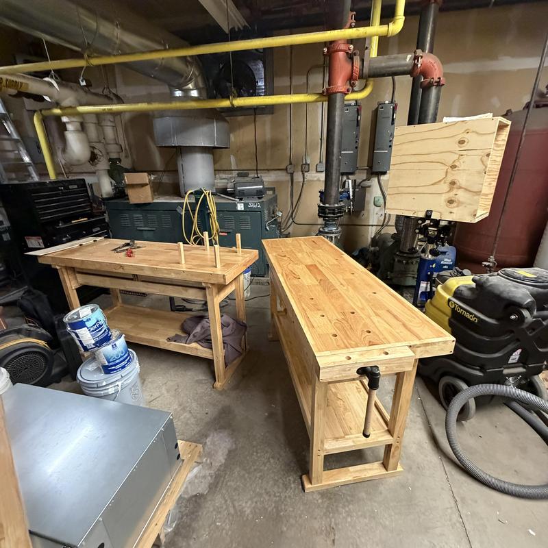 Boiler room wooden workbenches installation in progress Boiler room wooden workbenches installation in progress