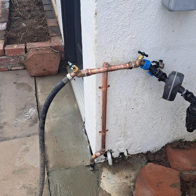 Copper water line with shutoff valves and hose connection