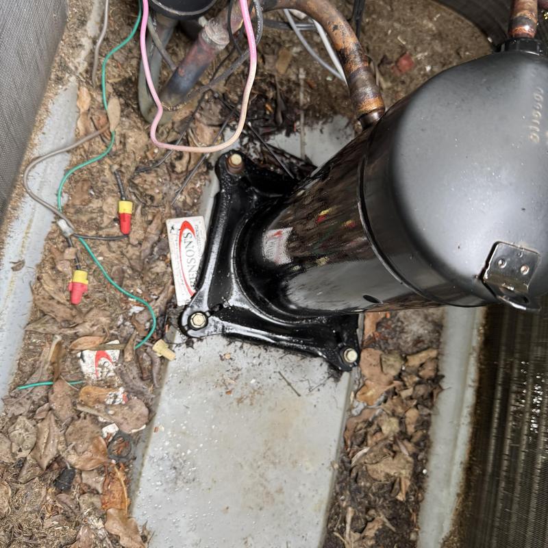 Compressor unit with wiring and debris buildup Compressor unit with wiring and debris buildup