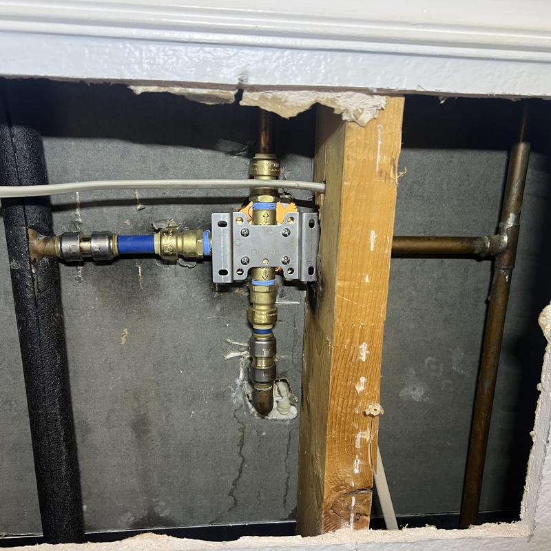Shower valve plumbing installation behind access panel Shower valve plumbing installation behind access panel