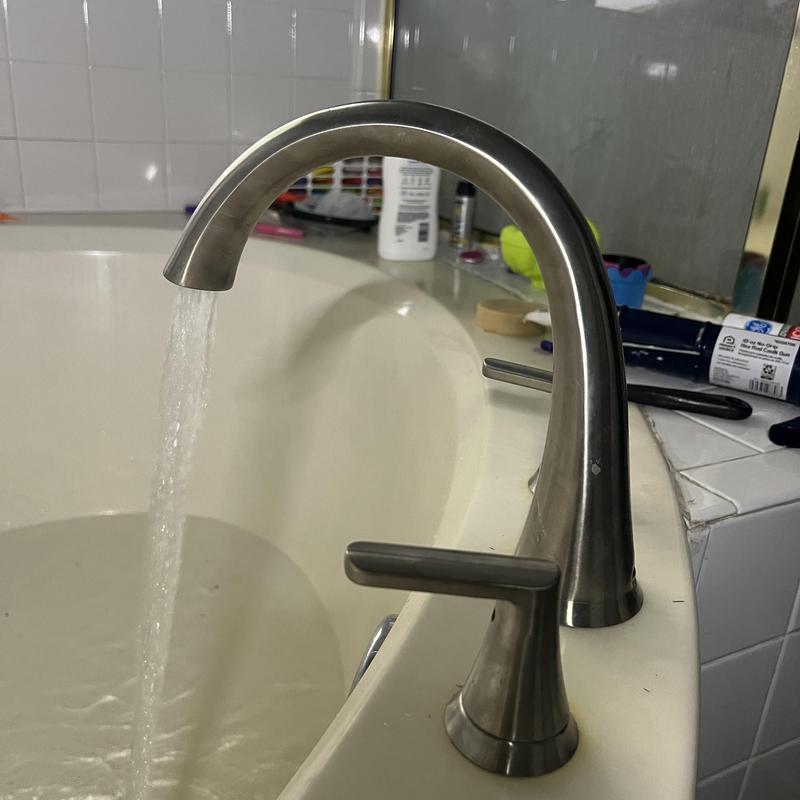 Roman tub faucet and handles with running water