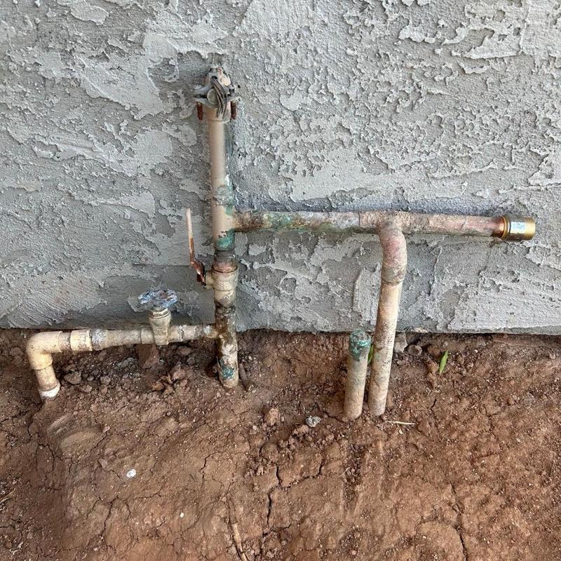 Copper water service pipes with shutoff valve outdoors Copper water service pipes with shutoff valve outdoors