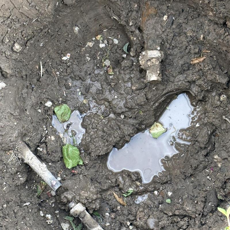 Waterline pipe and meter leak in muddy yard