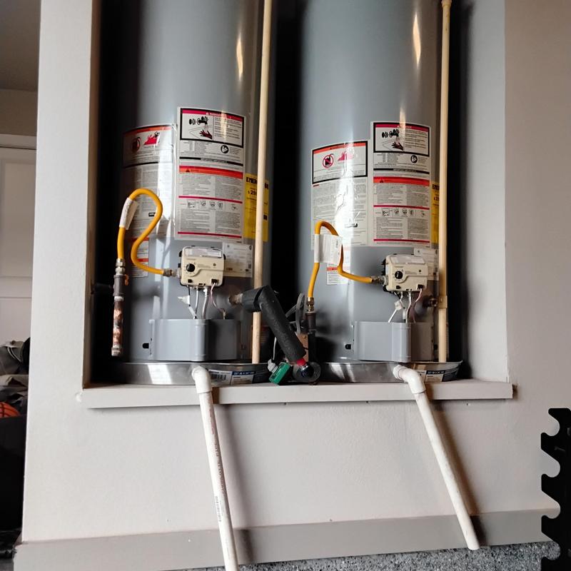 Tank water heaters with sediment flush and relight