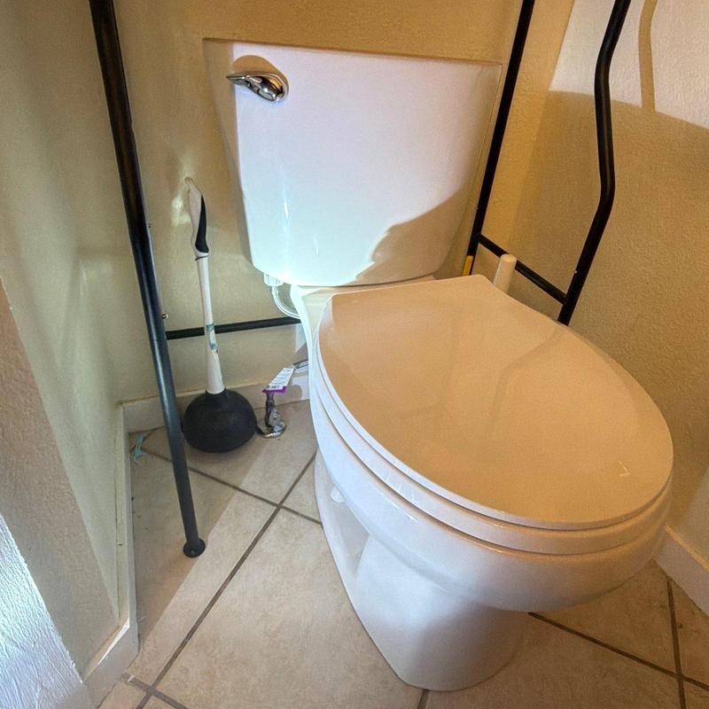 Toilet and tank installed in bathroom corner Toilet and tank installed in bathroom corner