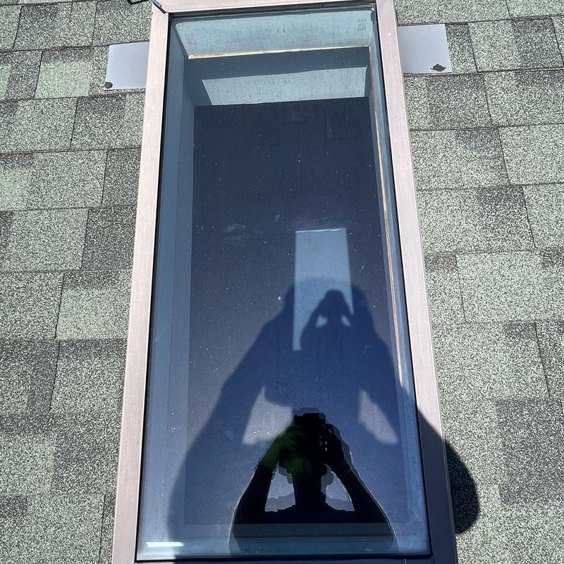 Skylight installation on asphalt shingle roof