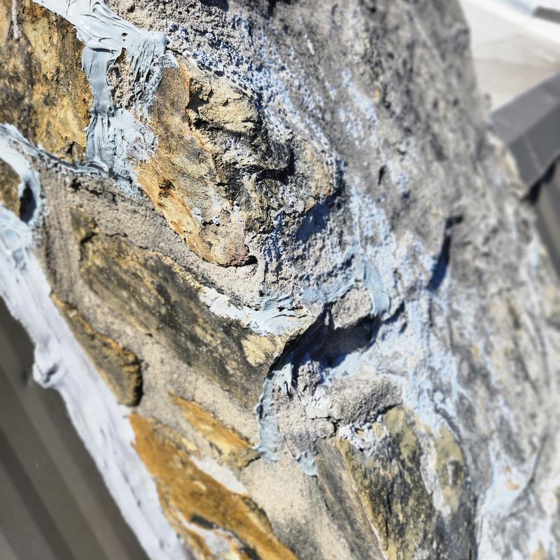 Sandstone wall cracks with sealing material applied Sandstone wall cracks with sealing material applied