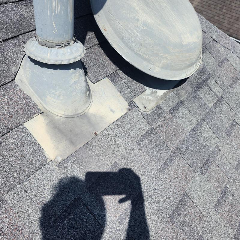 Roof vent flashing and satellite base on Pewter Gray shingles Roof vent flashing and satellite base on Pewter Gray shingles