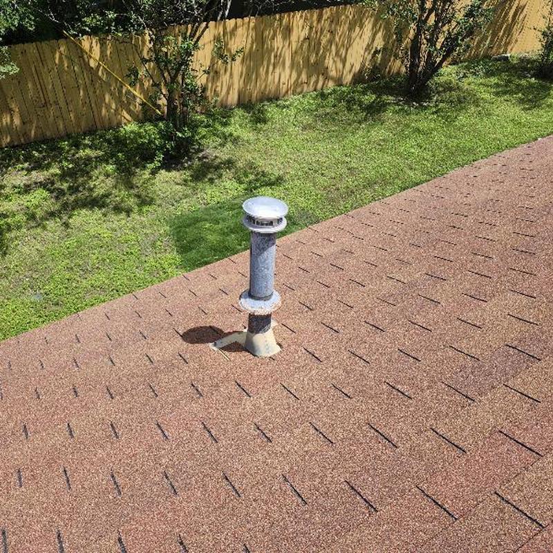 Heater vent collar on GAF Golden Cedar shingle roof Heater vent collar on GAF Golden Cedar shingle roof
