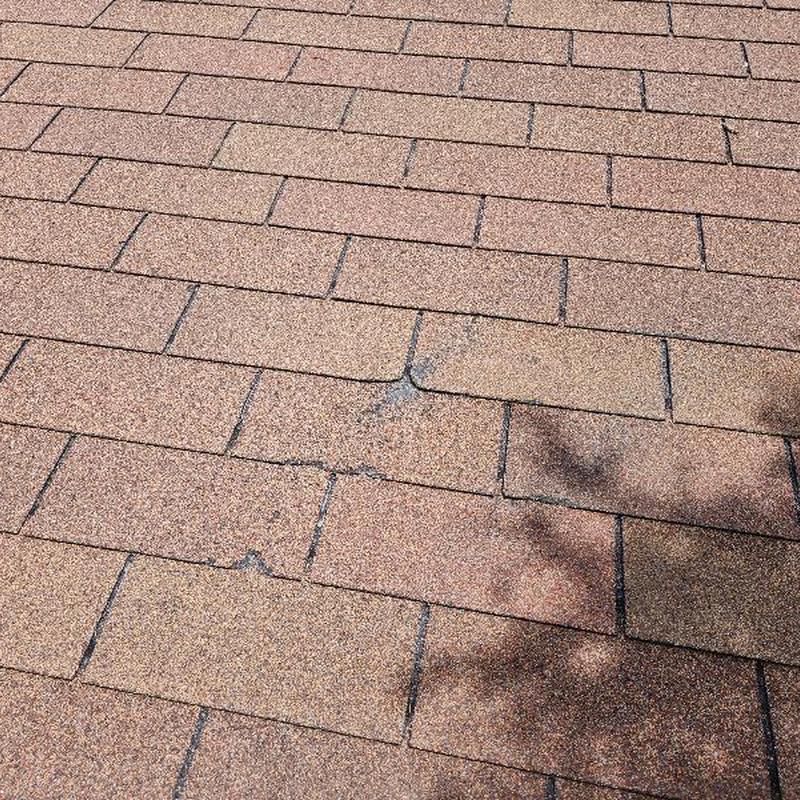 GAF Golden Cedar 3-tab shingles with damage marks GAF Golden Cedar 3-tab shingles with damage marks