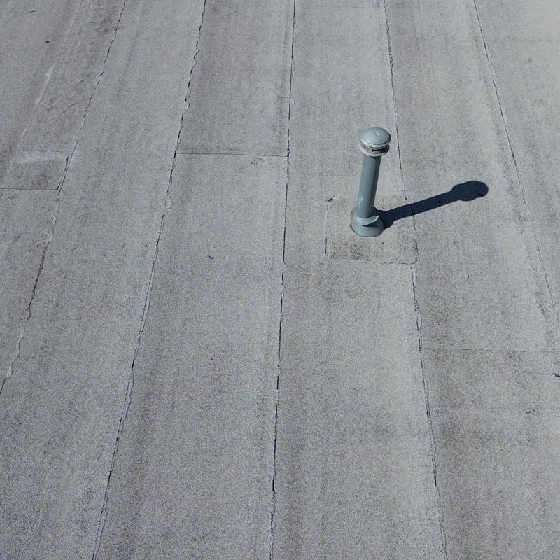 Rolled roofing with hail damage and vent pipe Rolled roofing with hail damage and vent pipe