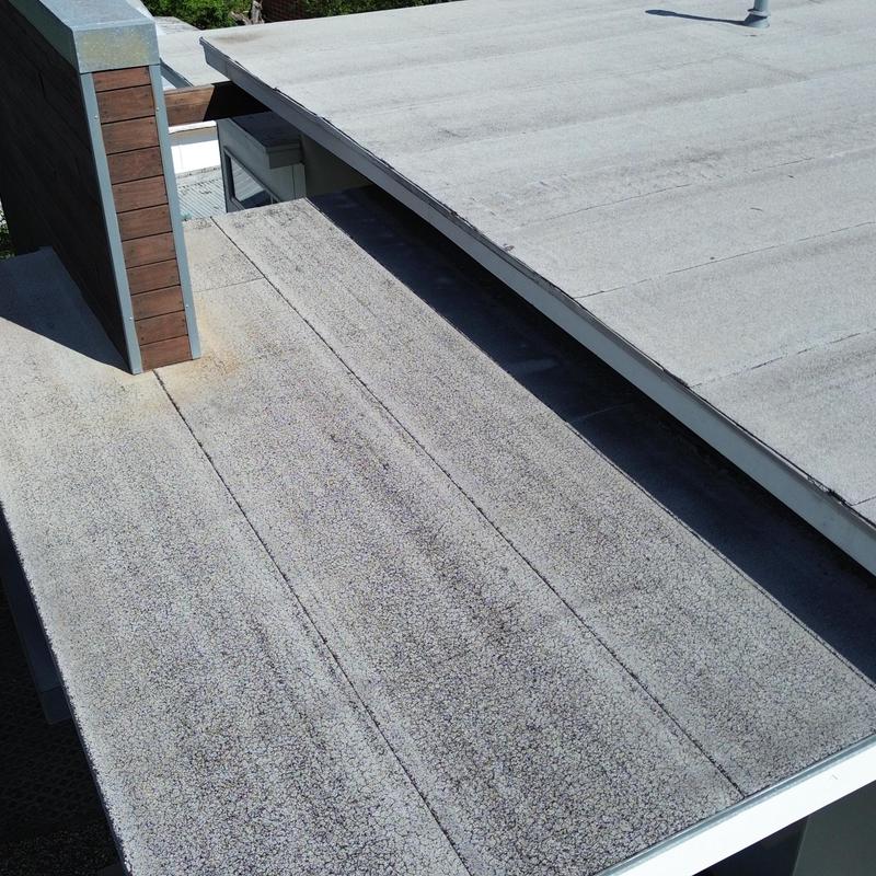 Rolled roofing with hail damage on flat roof section Rolled roofing with hail damage on flat roof section