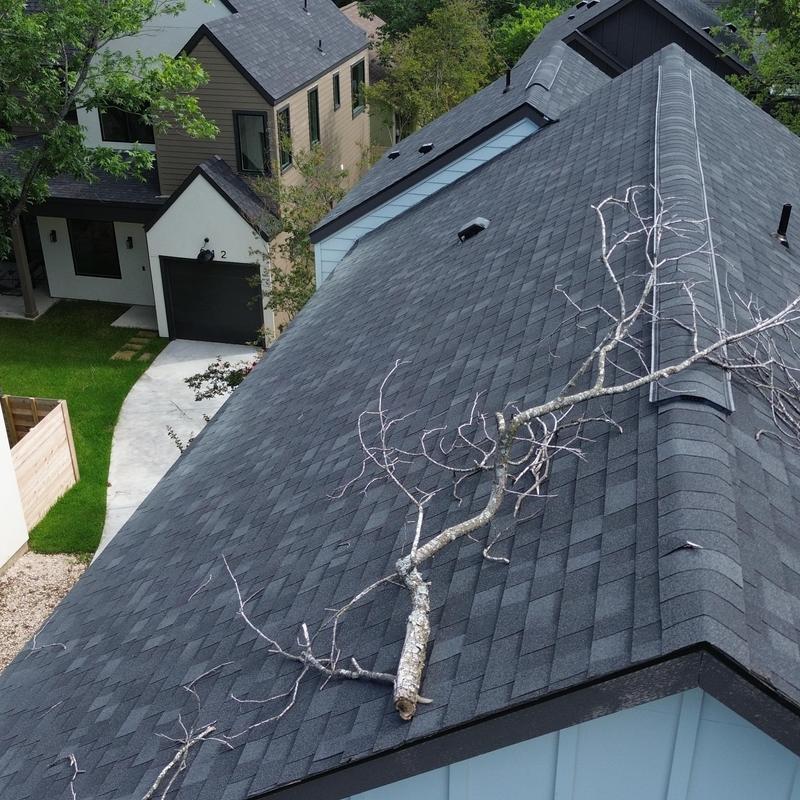 Owen Corning 30-yr Charcoal shingle roof with tree branch Owen Corning 30-yr Charcoal shingle roof with tree branch