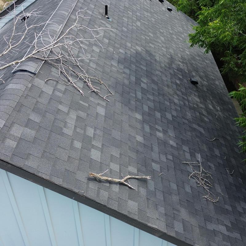 Owen Corning charcoal roof shingles with debris Owen Corning charcoal roof shingles with debris