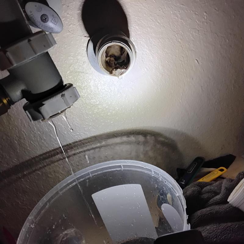 AC condensate drain line with buildup blockage cleared
