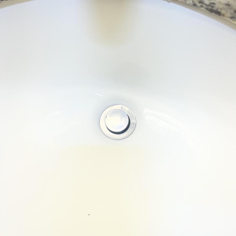 Sink pop-up drain in white basin Sink pop-up drain in white basin