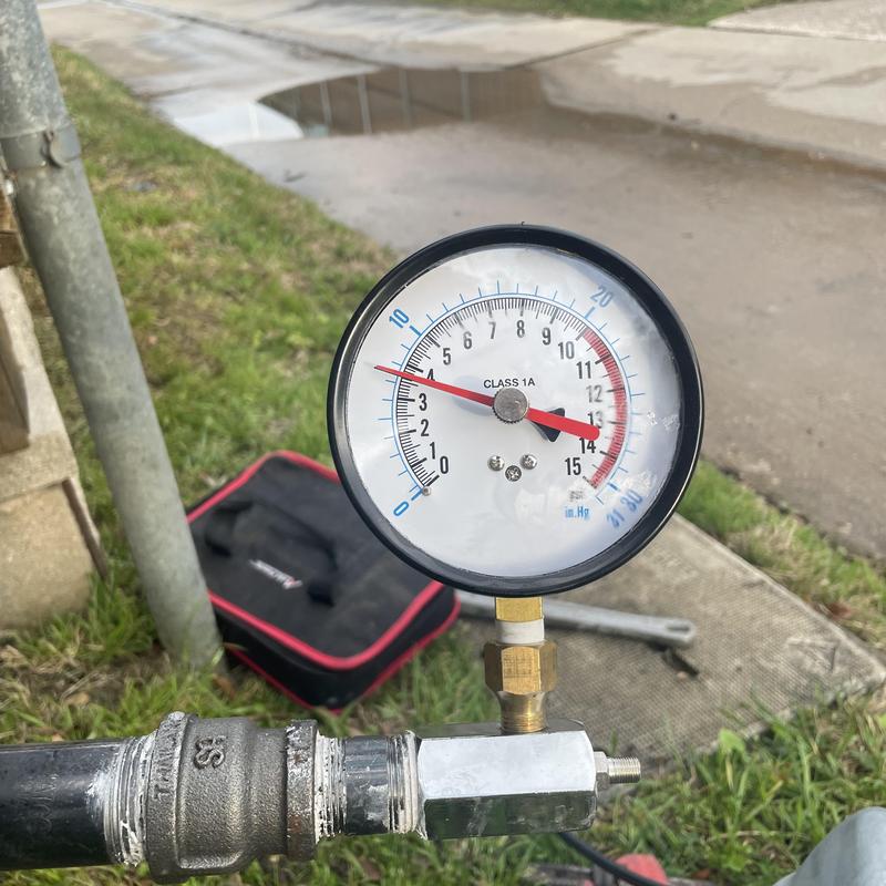 Gas meter pressure gauge indicating small leak detection