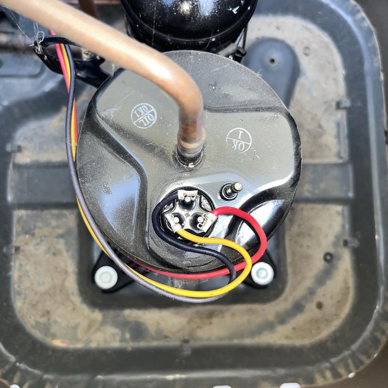 Goodman AC compressor with electrical wiring and tubing