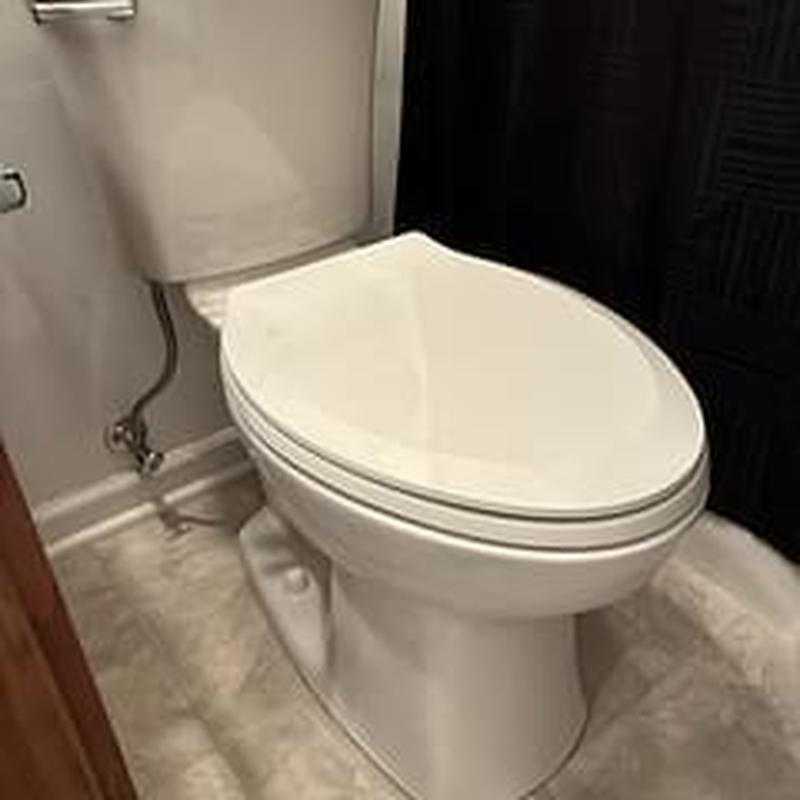 Customer supplied toilet installed in bathroom corner