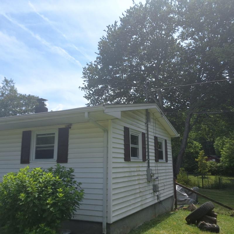 Vinyl siding exterior with windows and shutters Vinyl siding exterior with windows and shutters