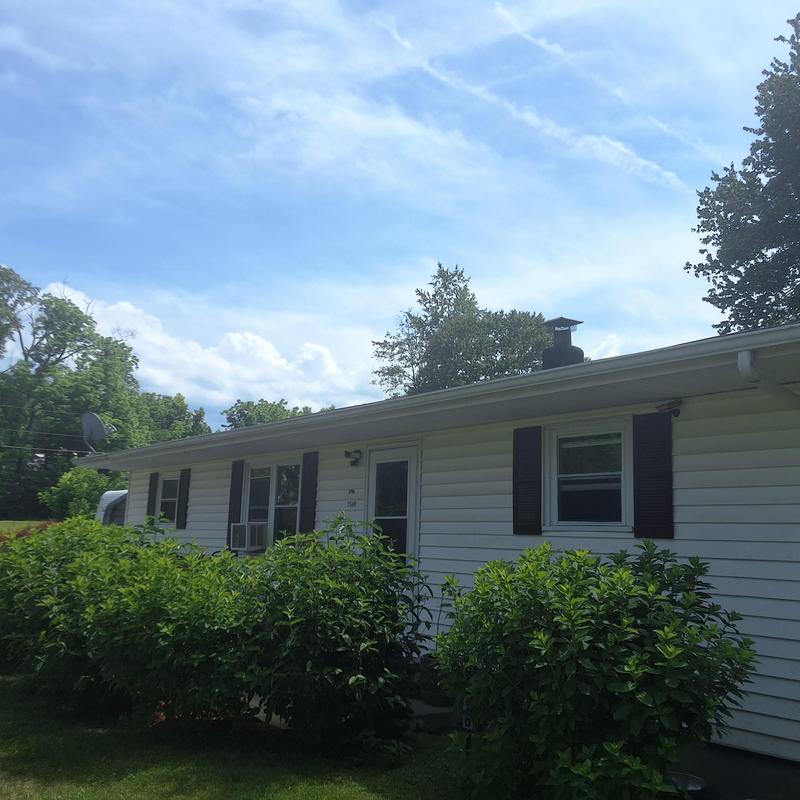 Roof shingles inspection on residential home exterior Roof shingles inspection on residential home exterior