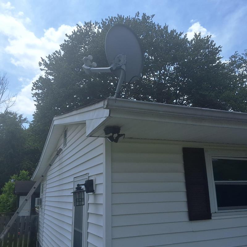 Satellite dish installation on home roof edge Satellite dish installation on home roof edge