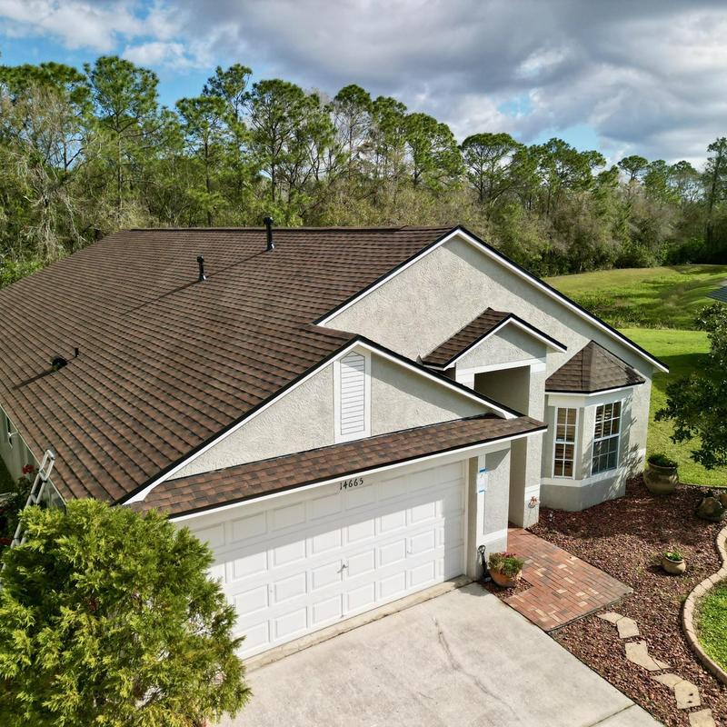 Architectural shingle roof with ridge venting on house Architectural shingle roof with ridge venting on house
