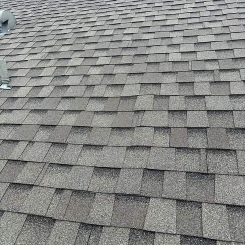 Shingle roof with damaged and missing shingles Shingle roof with damaged and missing shingles