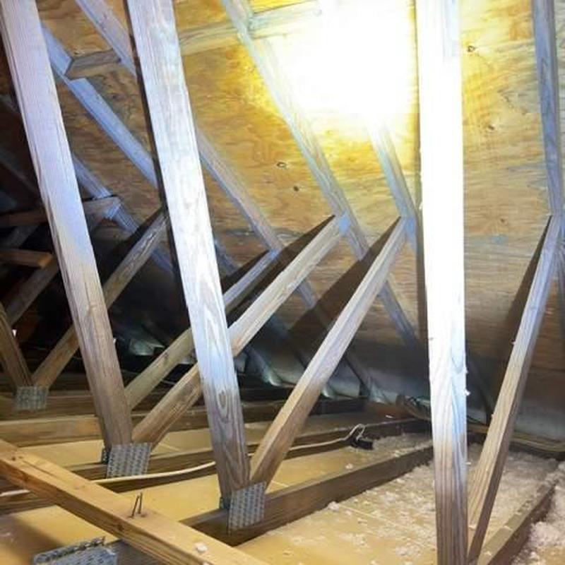Roof decking inspection showing wood trusses and plywood Roof decking inspection showing wood trusses and plywood