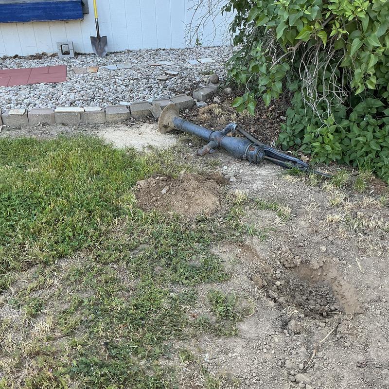 Septic line section exposed with repair hole nearby Septic line section exposed with repair hole nearby